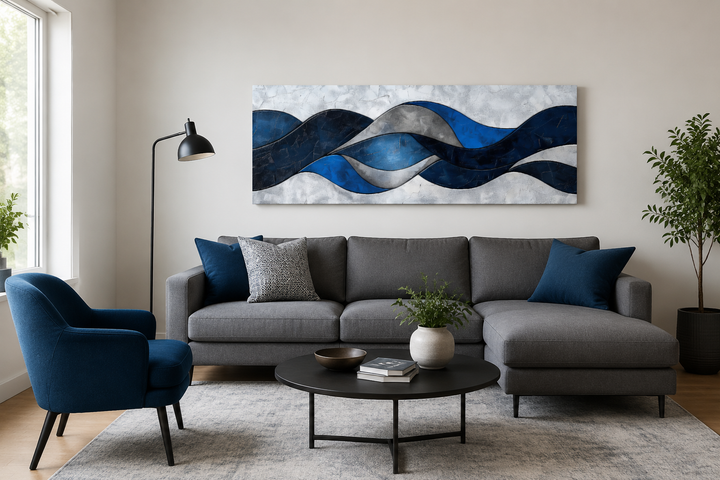 Navy blue and grey geometric modern abstract canvas wall art displayed above a grey sofa.