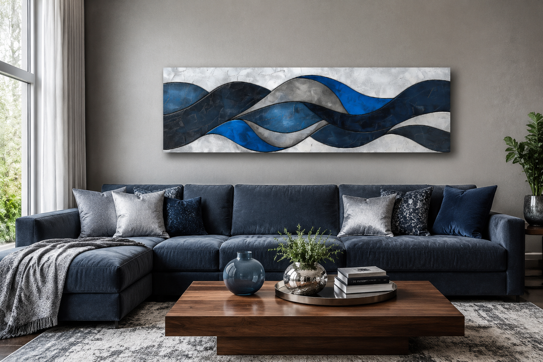 Navy blue and grey geometric modern abstract canvas wall art displayed above a navy blue sofa.