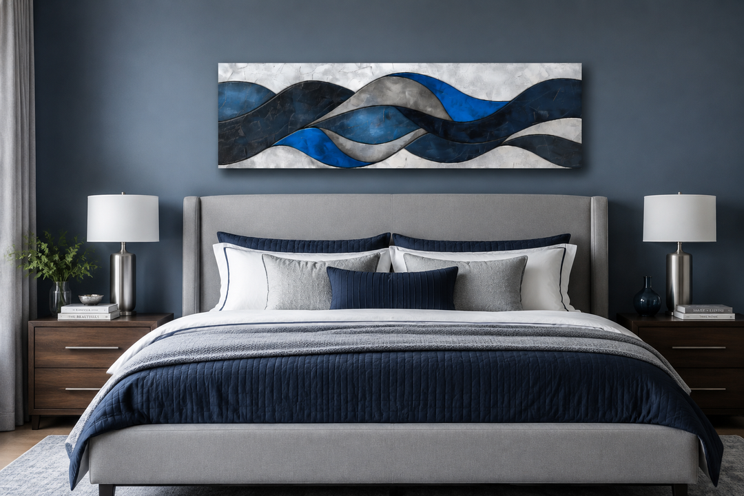 Navy blue and grey geometric modern abstract canvas wall art hanging above a bed.