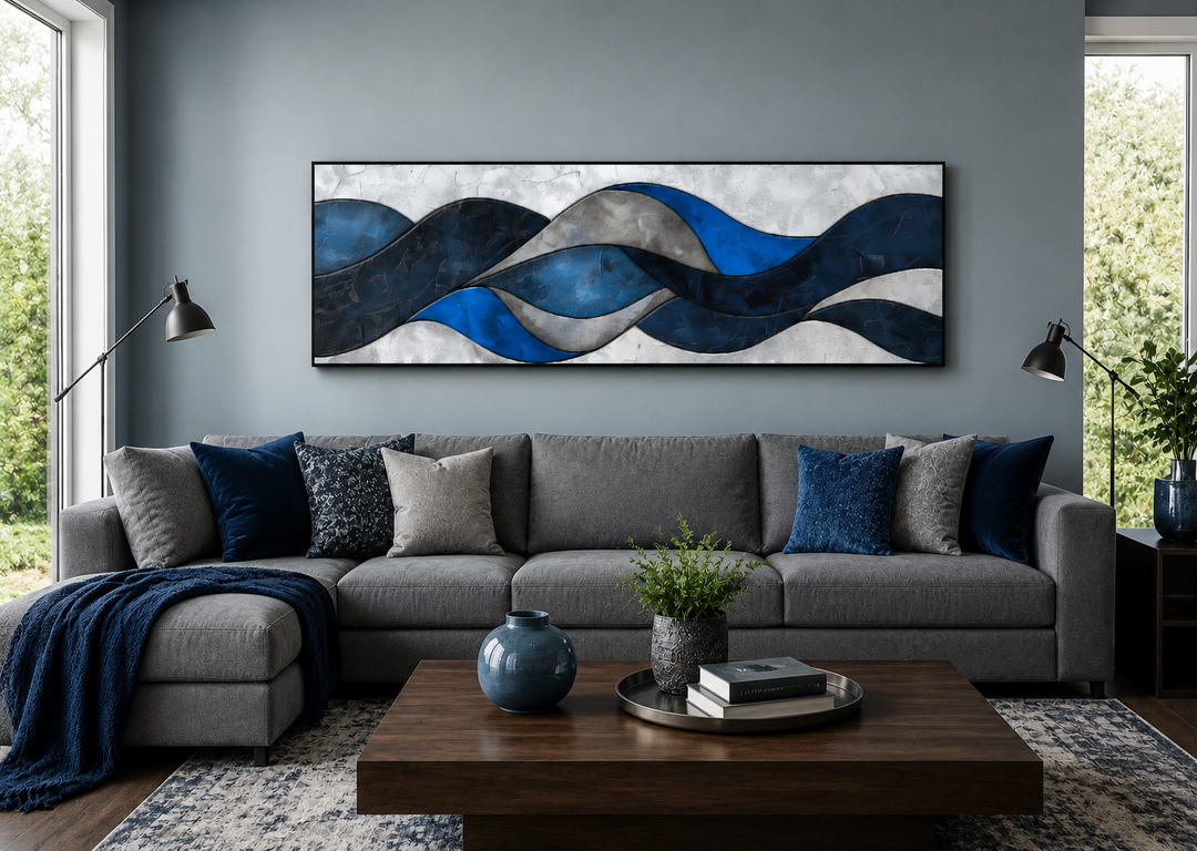 Navy blue and grey geometric modern abstract canvas wall art displayed above a grey sofa.
