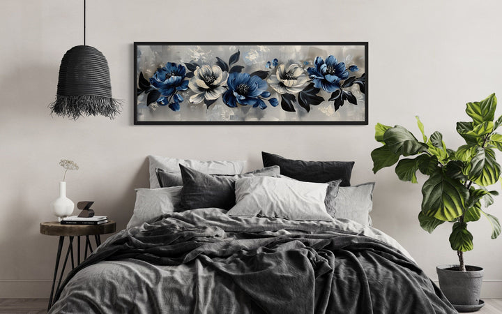 Horizontal framed canvas art with navy blue, grey, and white flowers.