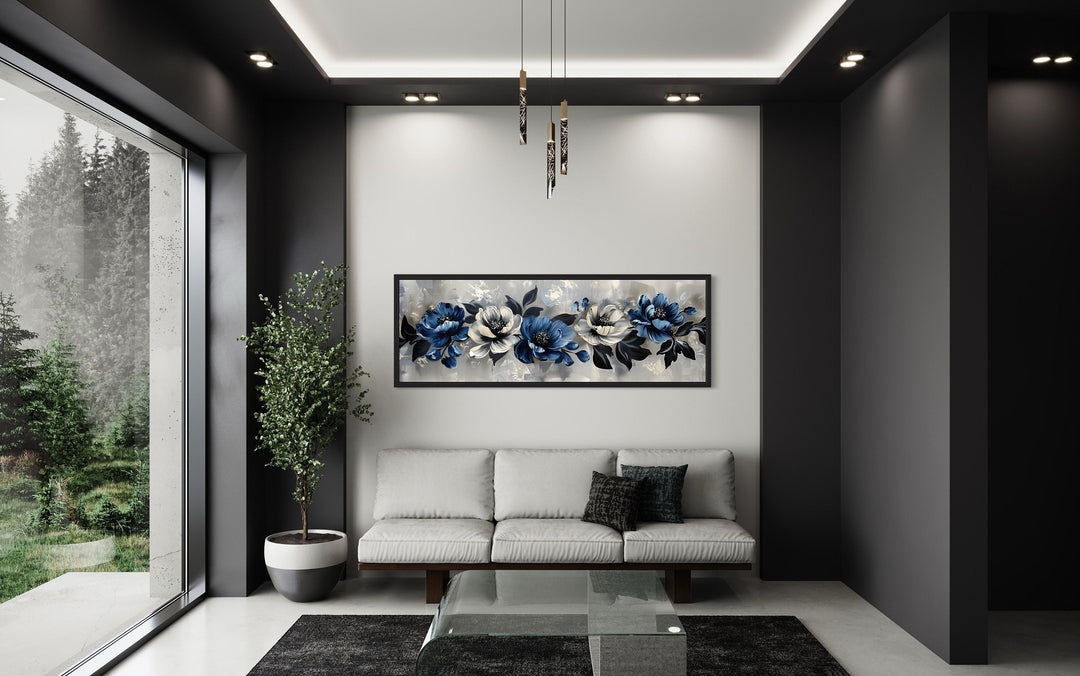 Horizontal framed canvas art with navy blue, grey, and white floral designs.