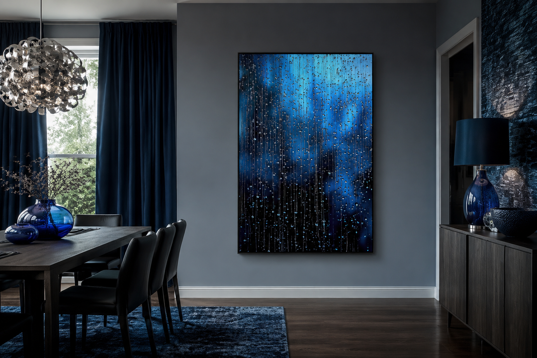Navy blue rain drops framed canvas wall art hanging in a modern dining room with dark blue accents.