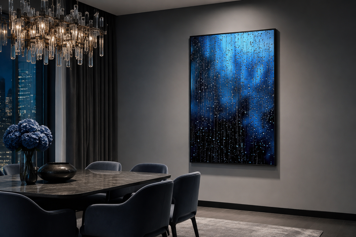 Navy blue rain drops framed canvas wall art hanging in a modern dining room with dark grey walls.