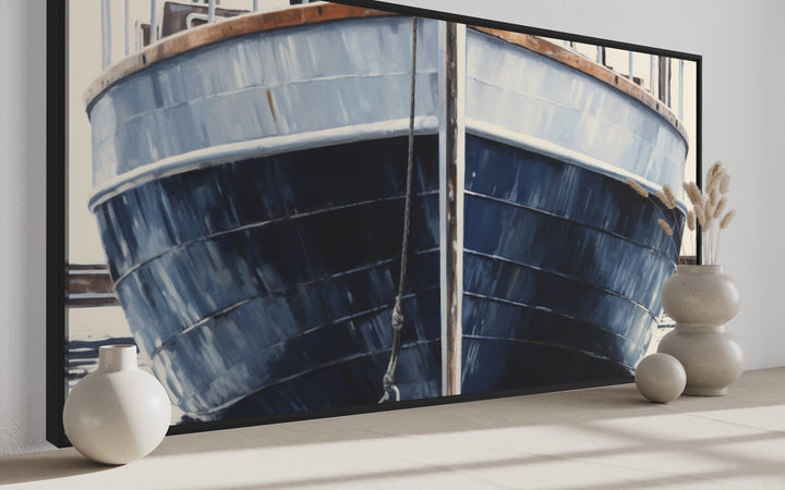 Close-up framed canvas wall art of a rustic navy blue boat hull with nautical vases on a shelf.