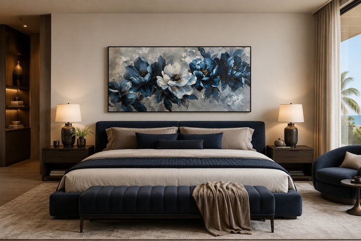 Large framed navy blue and white abstract floral canvas art hanging above a bed in a modern bedroom.