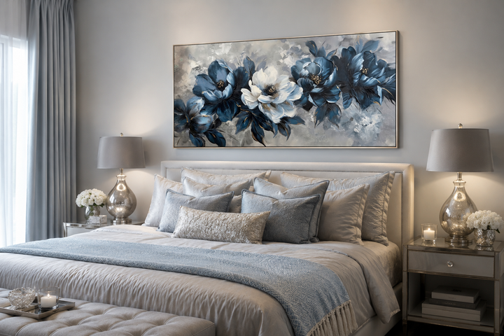 Large framed navy blue and white abstract floral canvas art hanging above a bed in a modern room.