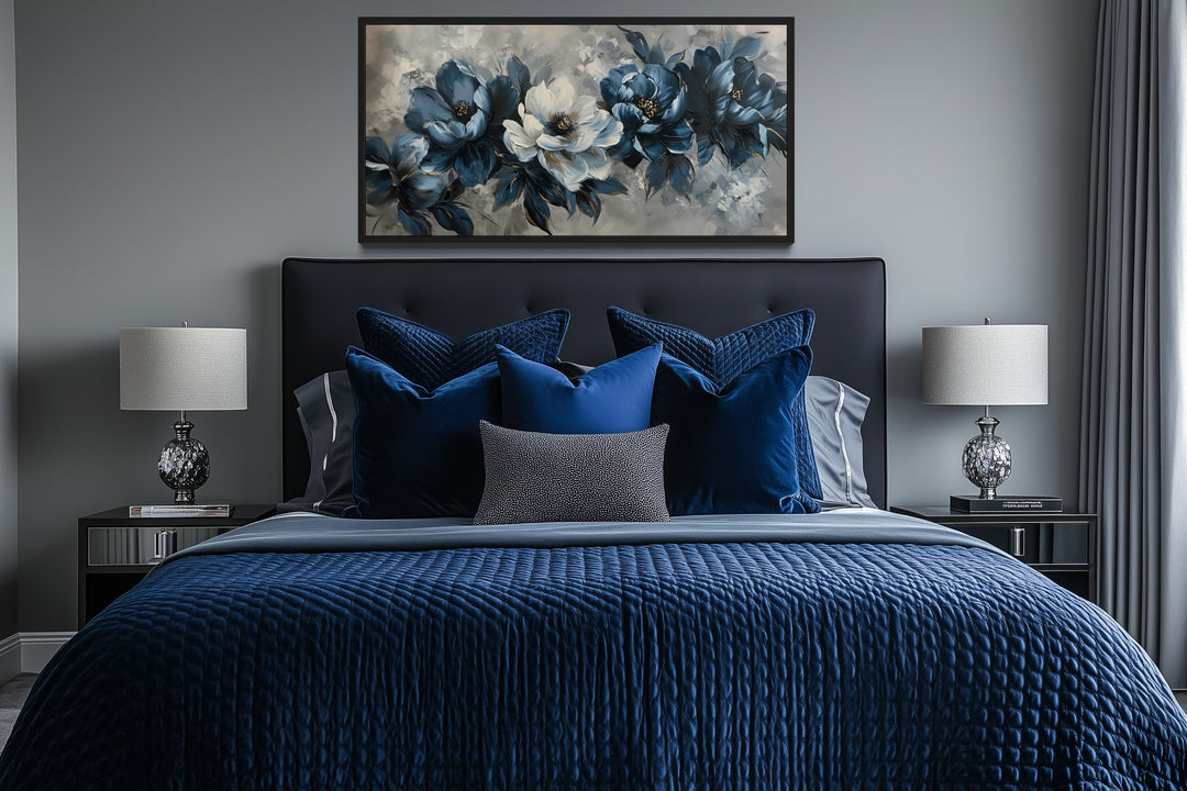 Framed navy blue and white abstract floral canvas wall art hanging above a bed in a modern bedroom.