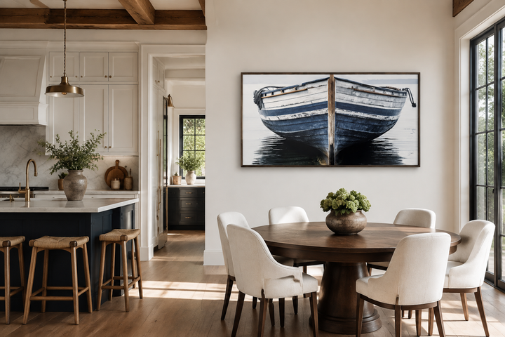 Navy blue and white old boat painting framed canvas wall art in a modern dining room.