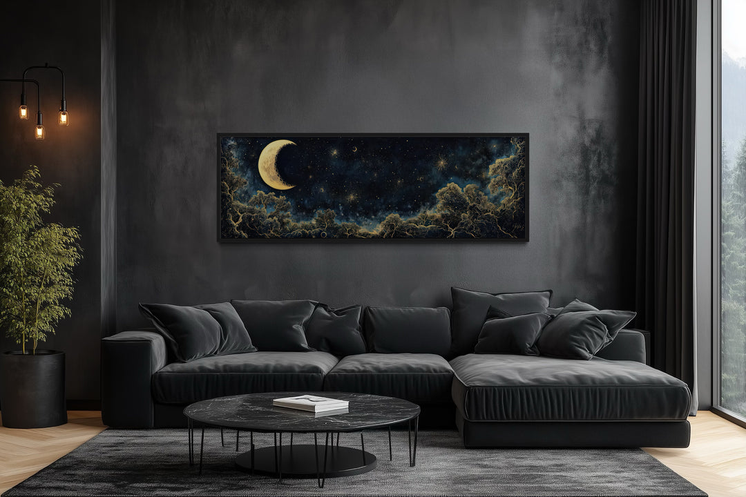 Navy blue and gold crescent moon and starry night sky horizontal wall art above a black sofa.