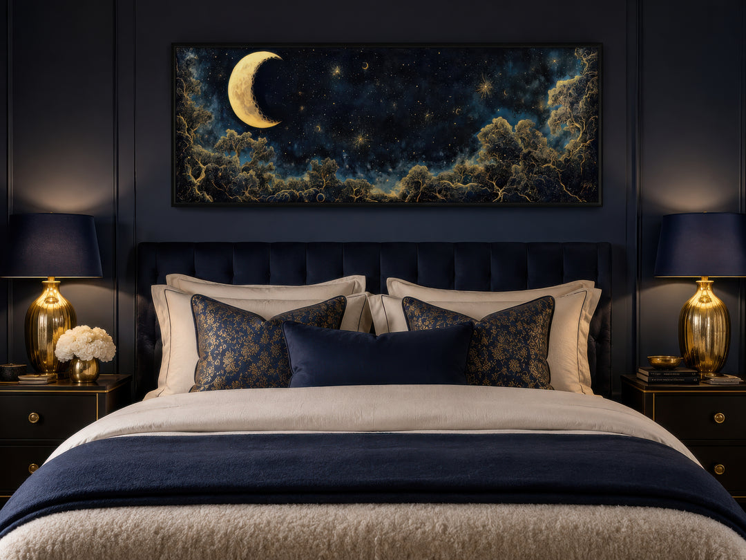 Navy blue and gold moon crescent long horizontal wall art hanging above a bed in a dark bedroom.