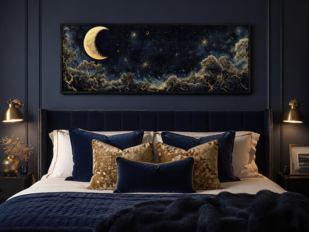 Navy blue and gold moon crescent long horizontal wall art hanging above a bed in a bedroom.