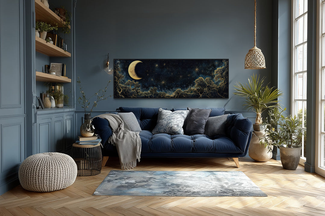 Navy blue and gold moon crescent long horizontal wall art above a sofa in a modern living room.