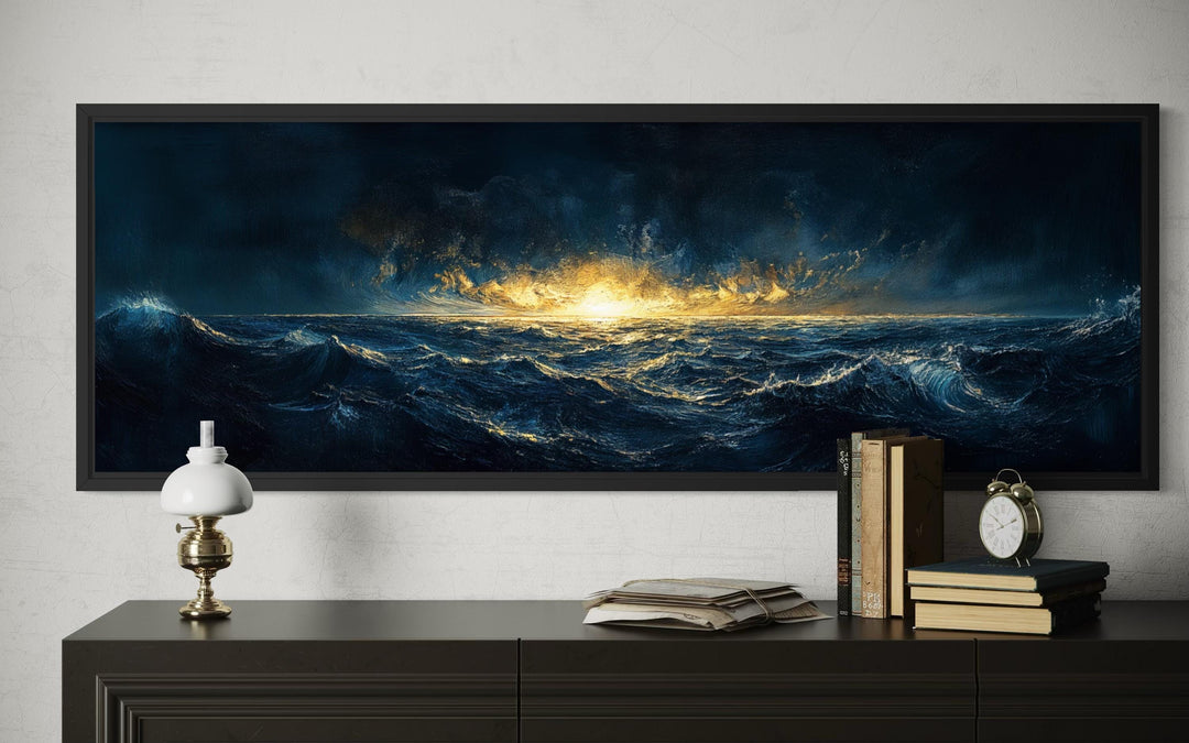 A panoramic navy and gold ocean sunset canvas print hangs above a dark dresser with vintage decor.