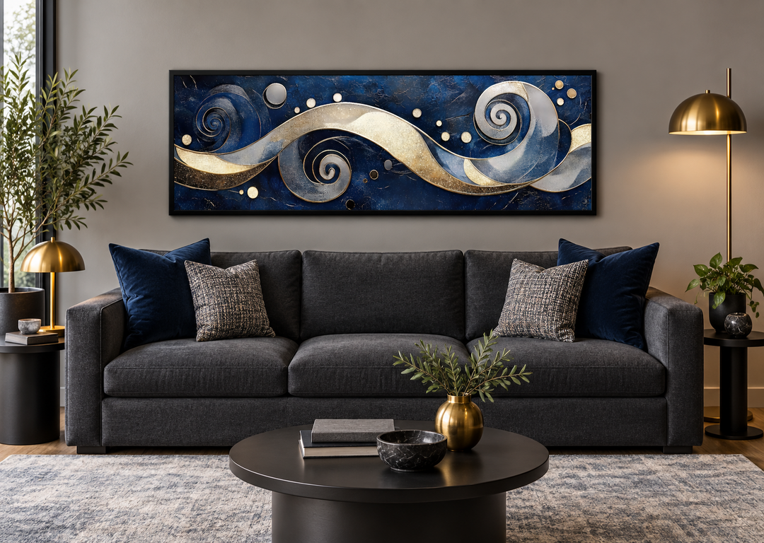 Navy and gold abstract swirl canvas art in a modern living room above a dark grey sofa.