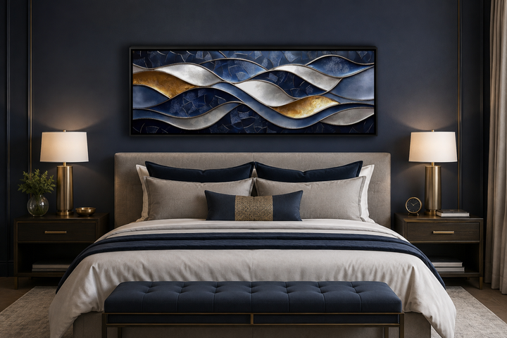 Navy and gold abstract wave horizontal wall art above a bed in a modern bedroom.