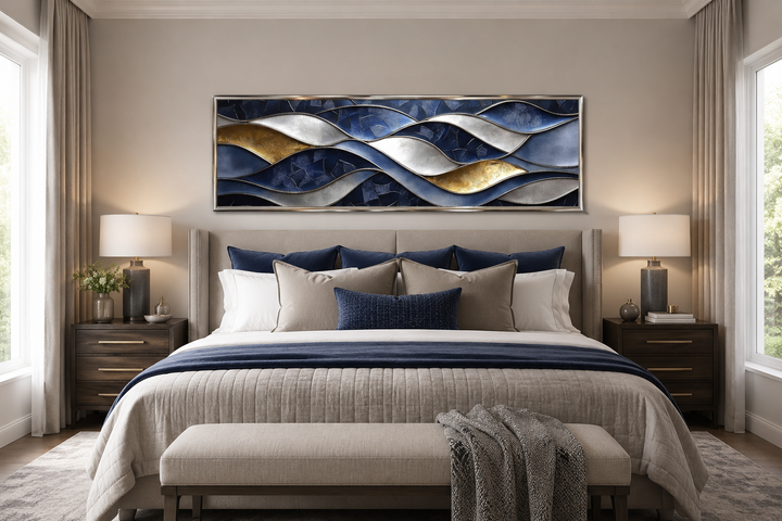 Navy and gold abstract wave horizontal wall art hanging above a bed in a modern bedroom.