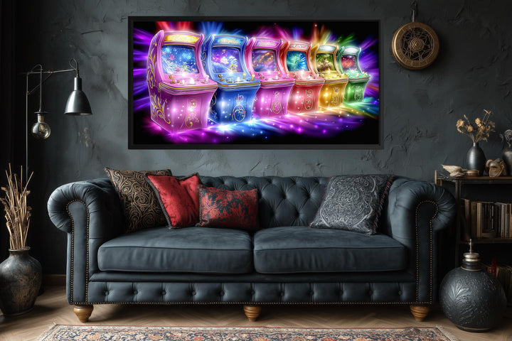 A horizontal canvas print of colorful neon arcade machines hangs above a dark tufted sofa.