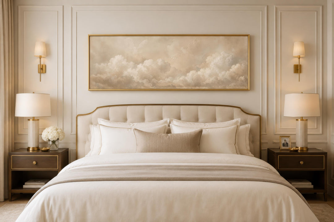 Long horizontal canvas art of beige and white clouds above a bed in a neutral-toned bedroom.
