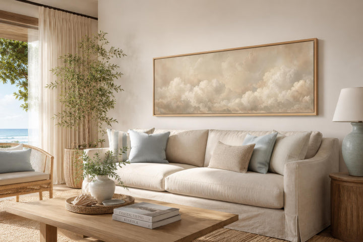 Long narrow wall art featuring three-dimensional white clouds on a warm beige background.