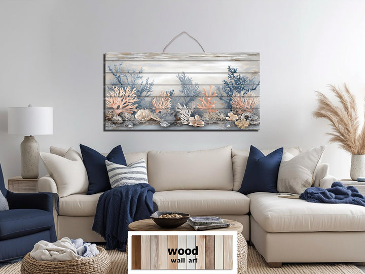 Horizontal wood wall art featuring coral in beige, blue, and peach tones above a neutral sofa.
