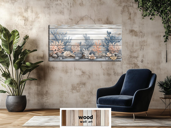 Horizontal wood wall art featuring coral in beige, blue, gray, and peach tones on a textured wall.