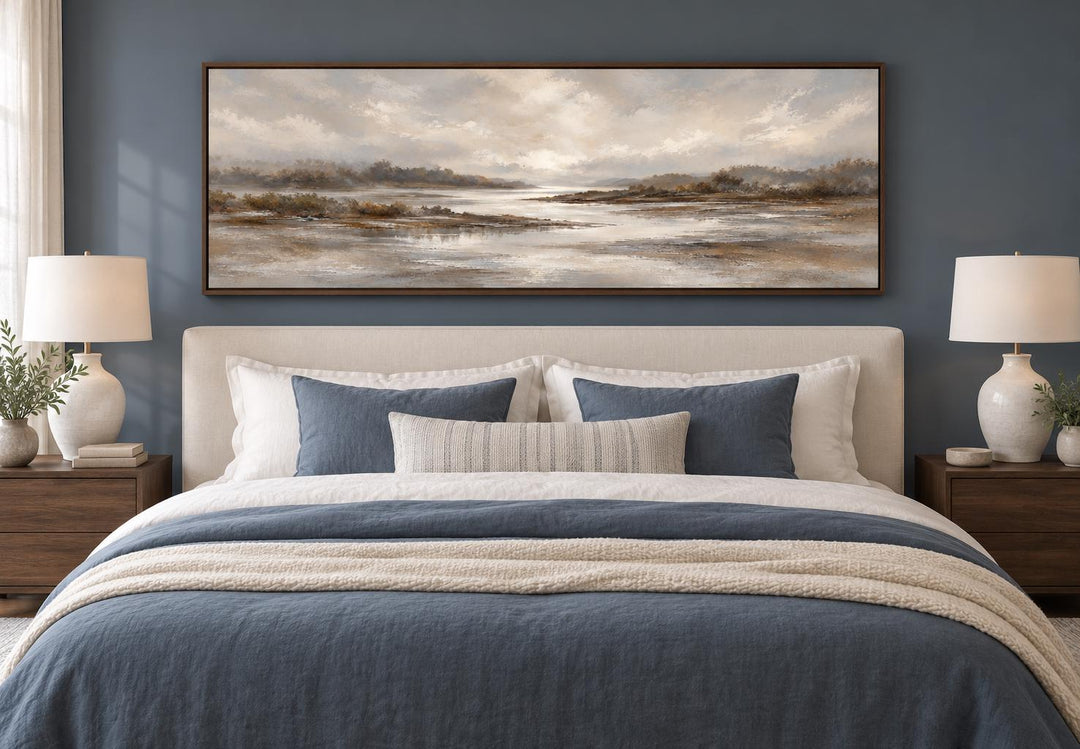 Neutral Earth Tones River Landscape Long Horizontal Canvas Wall Art above a bed in a blue bedroom.