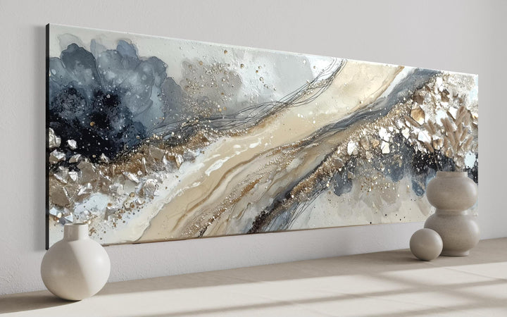 Long horizontal abstract canvas wall art in neutral grey, beige, and gold tones.