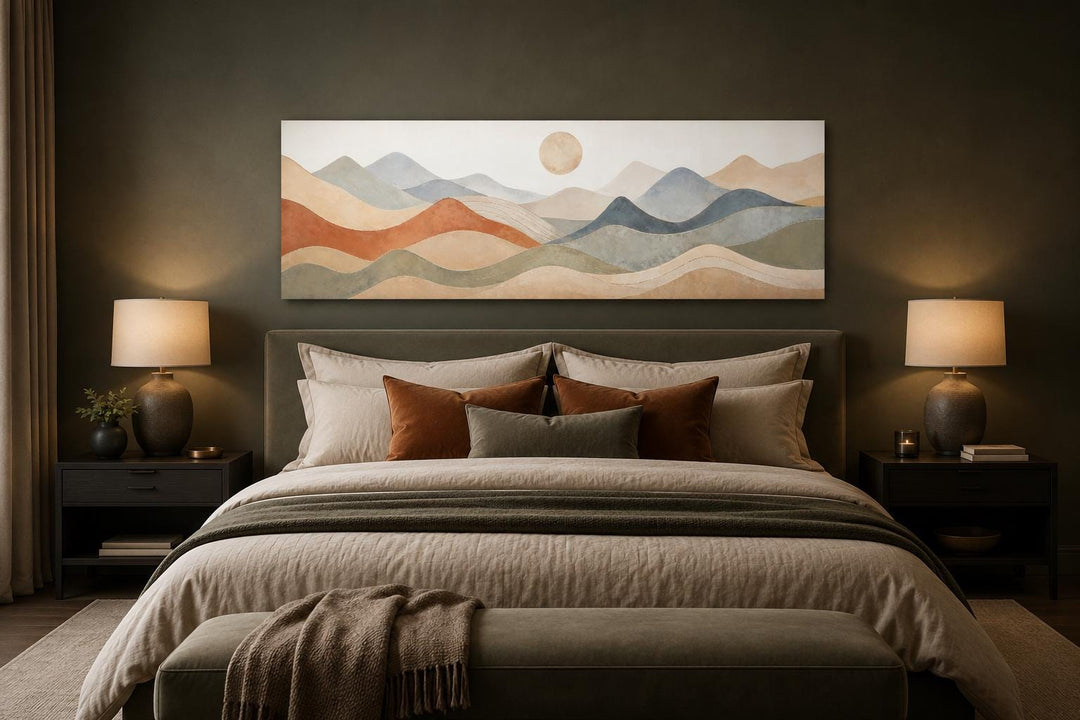 Neutral layered mountain landscape canvas art hanging above a bed in a modern bedroom.