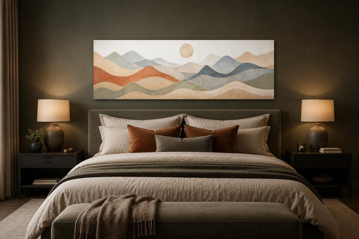 Neutral layered mountain landscape canvas art hanging above a bed in a modern bedroom.