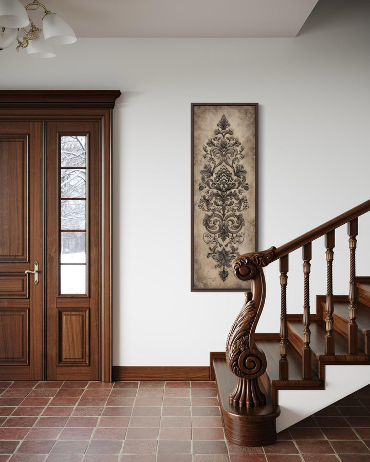 Neutral vertical tall narrow antique French ornamental damask canvas wall art in a home entryway.
