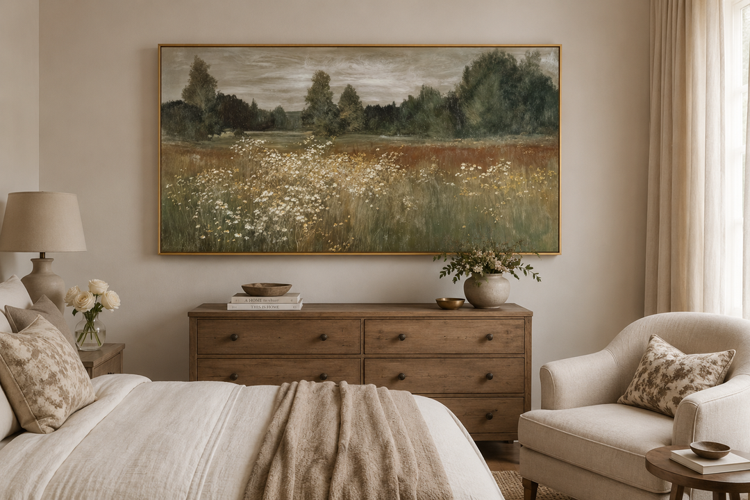 Large horizontal canvas print of a neutral wildflower meadow landscape in a farmhouse bedroom.