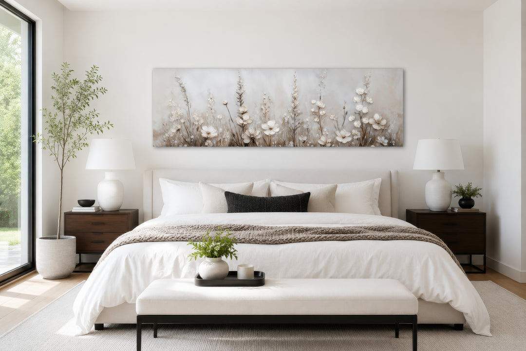 Neutral wildflower canvas wall art in a beige floral landscape style above a modern bed.