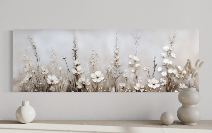 Neutral wildflower canvas print featuring beige floral art in a calm botanical landscape.
