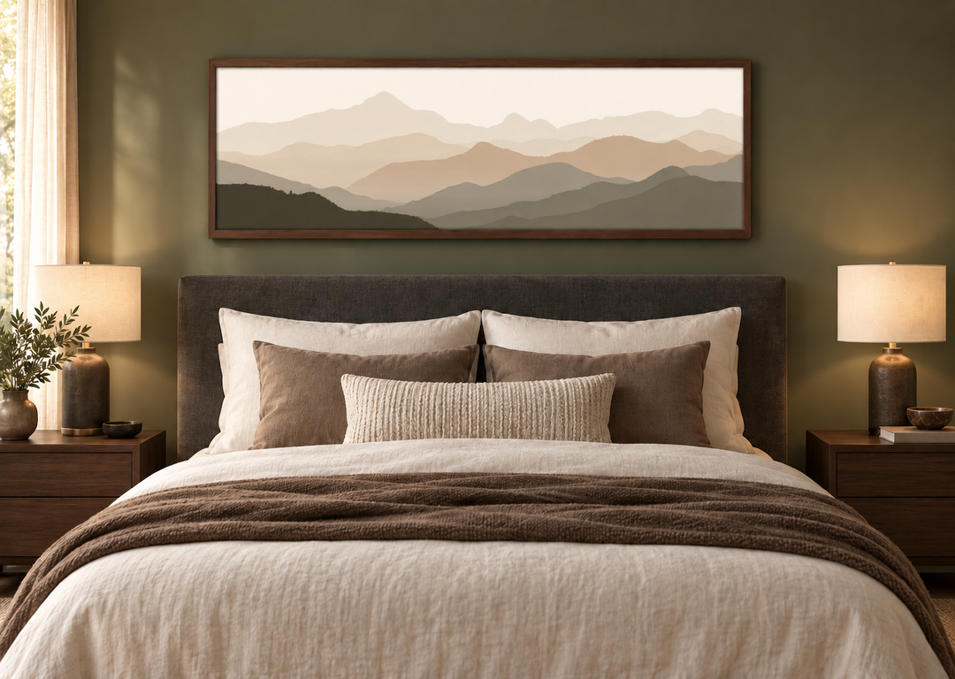 Panoramic minimalist mountain landscape wall art in neutral beige and brown above a bed.