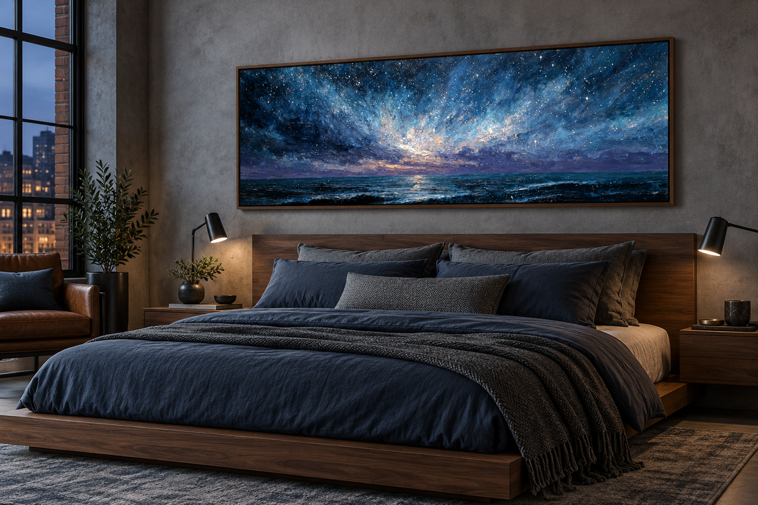 Panoramic blue navy and purple seascape canvas print above a modern walnut bed in a moody bedroom.