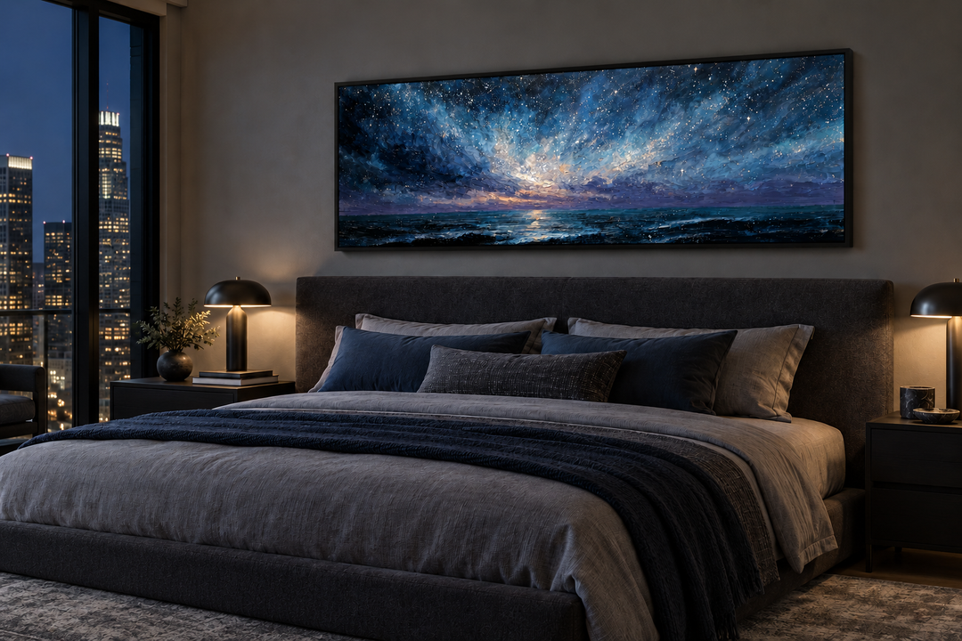 Panoramic blue navy and purple moody seascape canvas print above a bed in a modern bedroom.