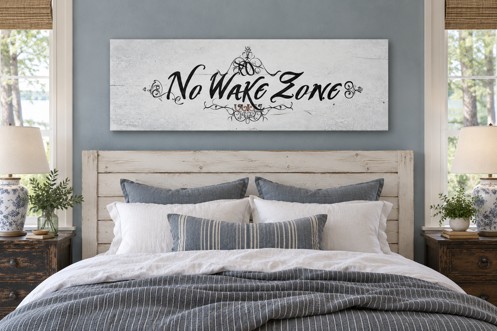 No Wake Zone long narrow framed canvas wall art hanging above a bed in a rustic farmhouse bedroom.