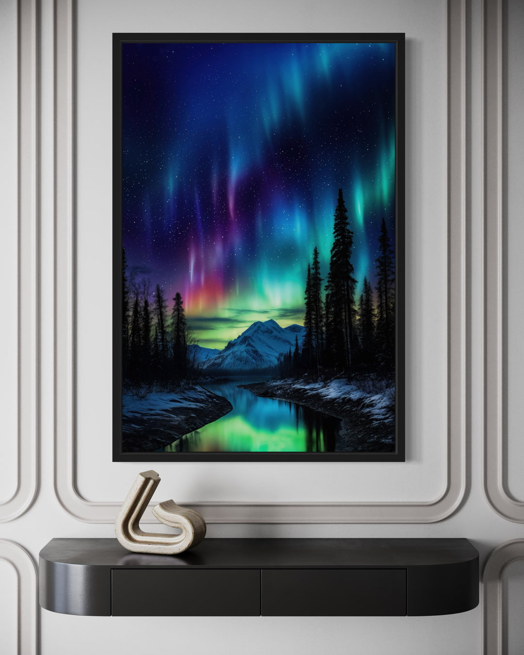 Framed canvas wall art of the Northern Lights over a snowy mountain and river landscape.