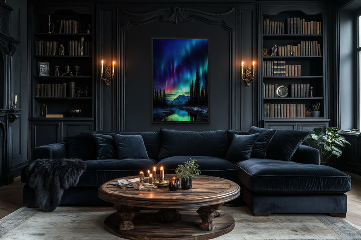 Northern Lights Aurora Borealis framed canvas wall art hanging in a dark, moody living room.