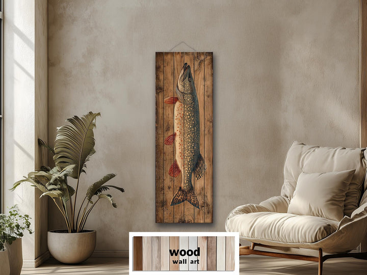 Northern pike vertical wall art on distressed wood planks in a rustic living room setting.