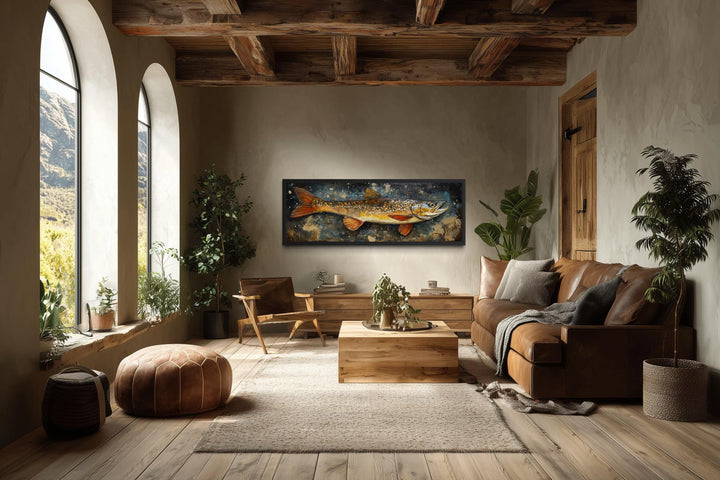 Northern Pike wall art in a rustic living room with wood beams and leather furniture.