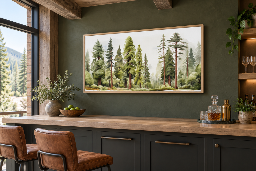 Woodlands forest watercolor framed canvas wall art hanging above a dark green kitchen bar.