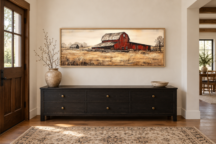 Old Red Barn rustic horizontal framed canvas wall art above a black sideboard in a farmhouse entry.