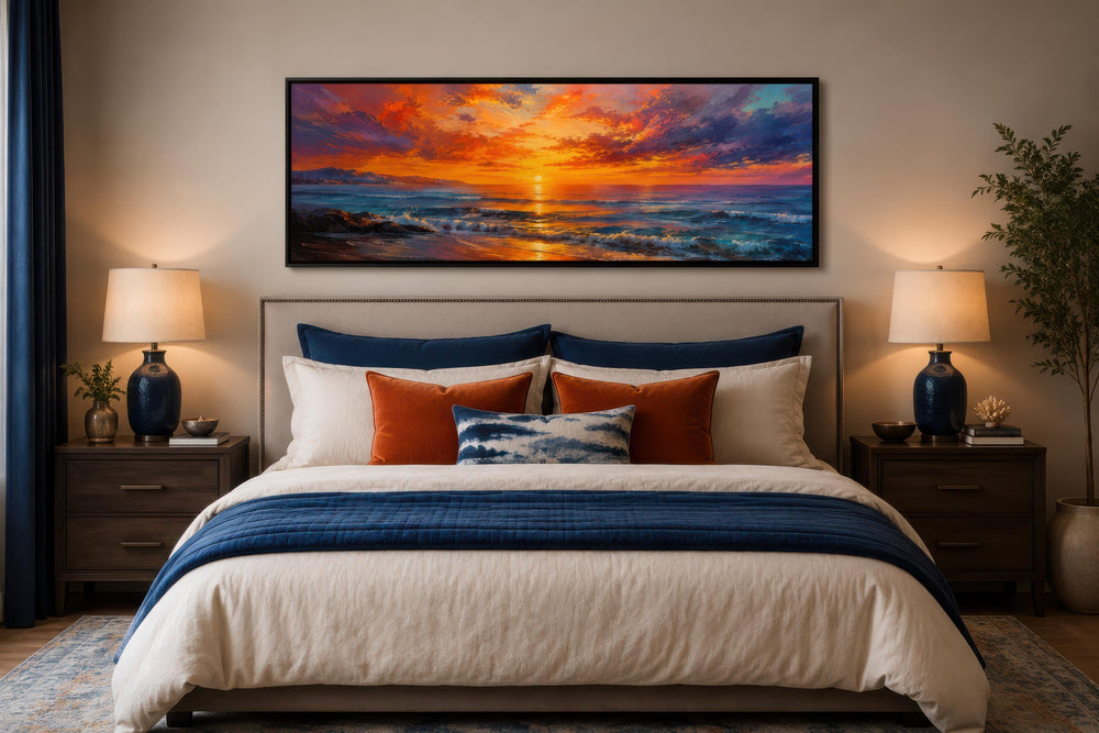 Ocean Sunset Wall Art: Long horizontal canvas with a fiery purple and orange sky above a bed.