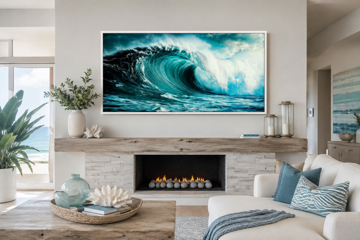 Ocean wave photography framed canvas wall art hanging above a fireplace in a coastal living room.
