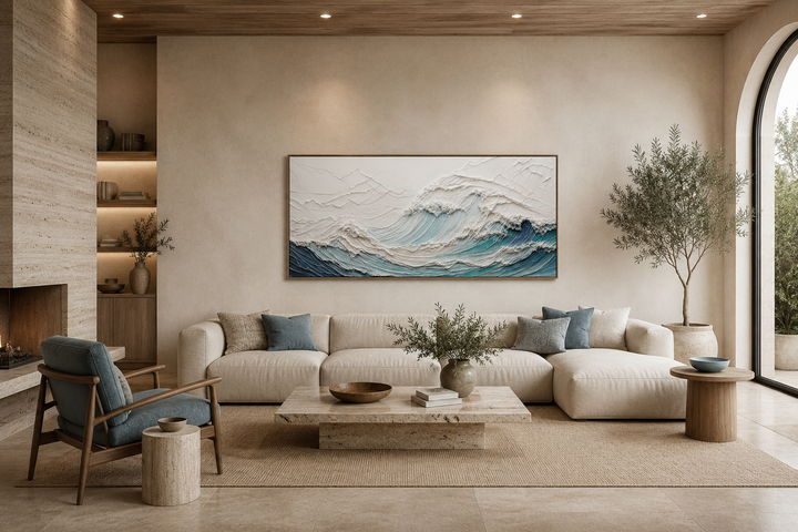 Textured 3D teal ocean wave canvas art centered above a modern sofa in a neutral living room.