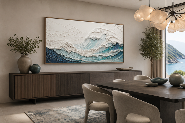 Textured teal and white ocean wave wall art in a modern dining room with a dark wood sideboard.