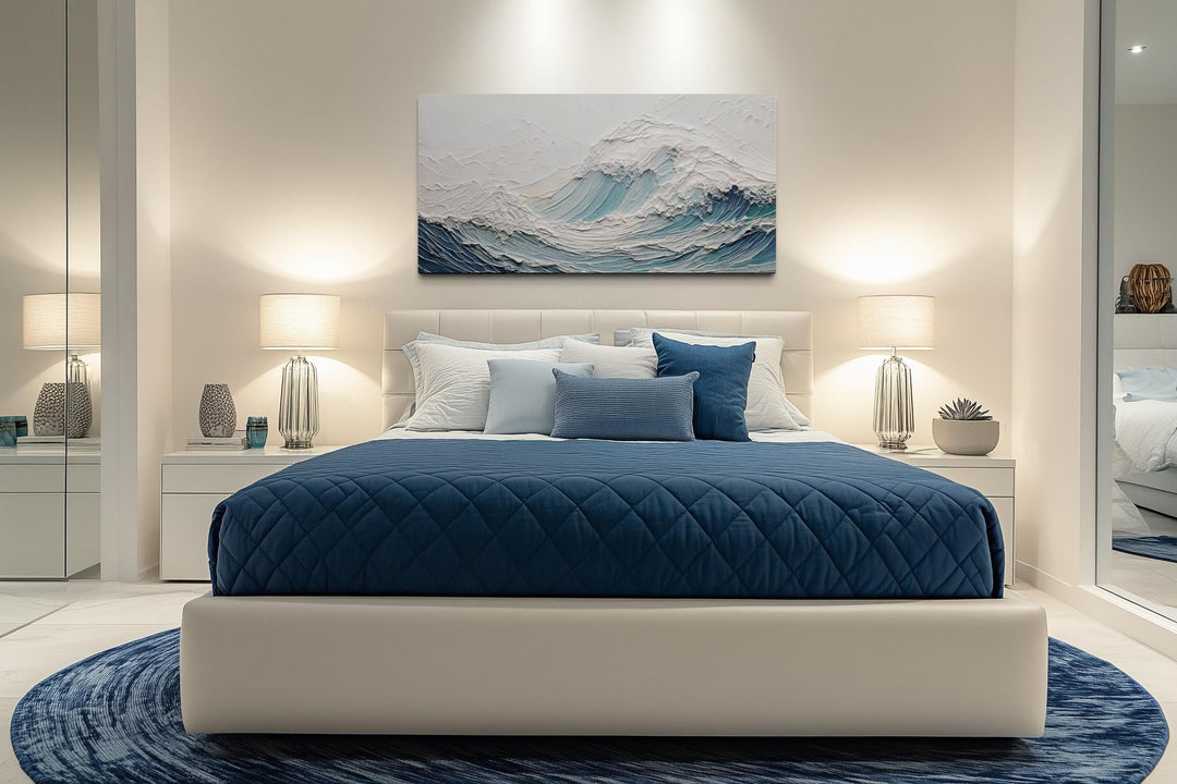 Textured teal ocean wave canvas art with a 3D illusion hanging above a modern bed.