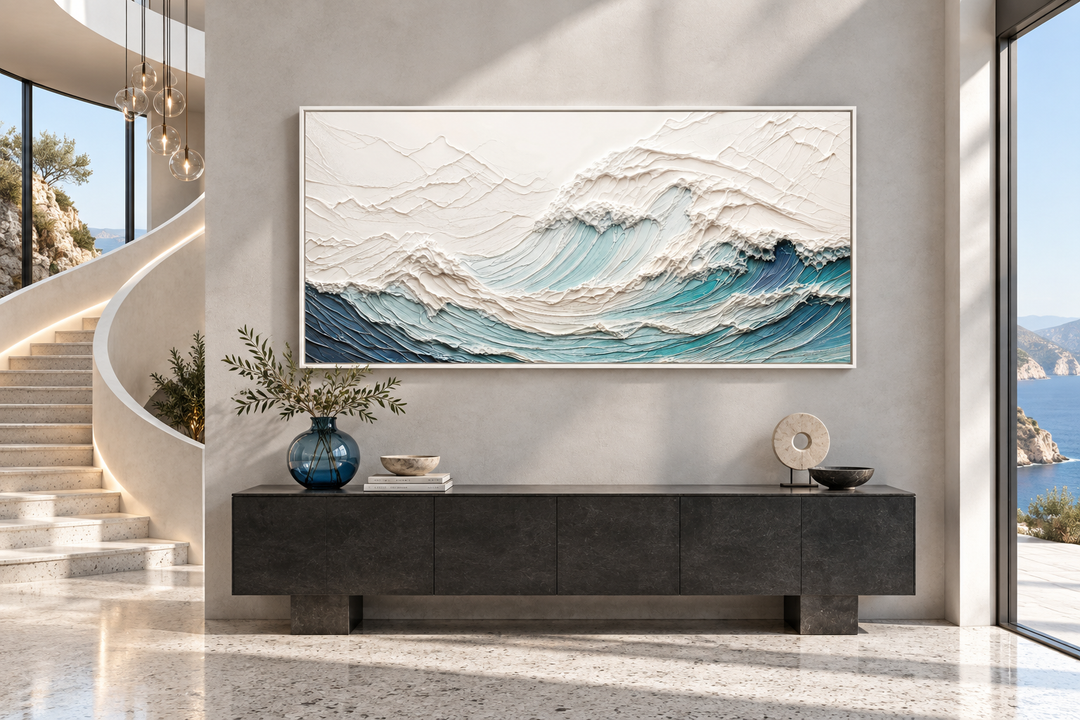 Textured 3D teal ocean wave wall art canvas above a dark console in a modern coastal interior.